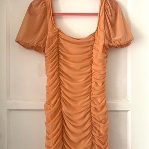 Brand new orange ruched mini dress
